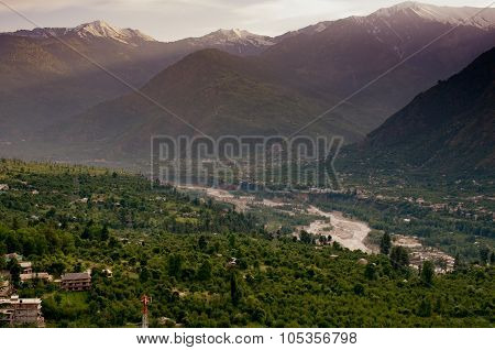 Evening view of Kulu valley with Himalaya range in background