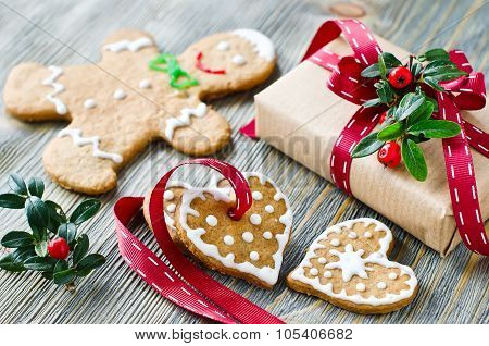 Christmas Gift Box And Gingerbread Cookies On Wooden Background