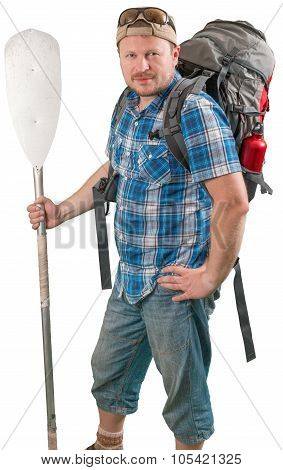 Tourist man with backpack and paddle