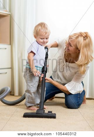 family have fun with cleaning with hoover - housework