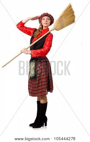 Funny woman in scottish clothing with broom