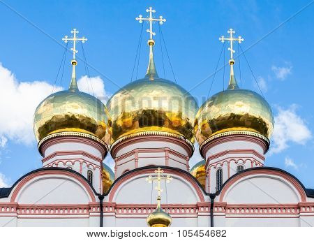 Golden Domes Of Russian Orthodox Church In Valday Monastery Against The Blue Sky