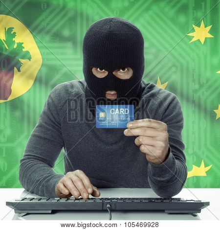 Dark-skinned Hacker With Flag On Background Holding Credit Card - Cocos (keeling) Islands