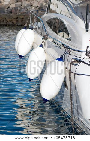 Boat on the water with buoys
