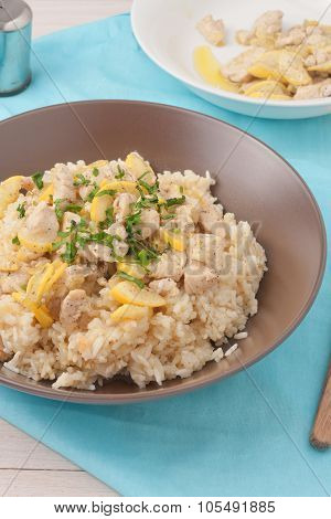 rice cooked in chicken stock and stir fried with chicken breast, zuchnini, garlic and spices garnish