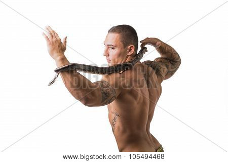 Muscular Man in Camo Pants with Snake Around Neck