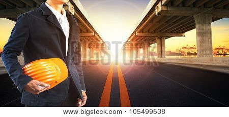 Sun Rising Behind Perspective On Bridge Ram Construction And Asphalt Raod Perspective To Ship Port B