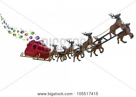 Santa Claus delivering gifts around the world by riding a sleigh led by reindeers isolated on white backgound