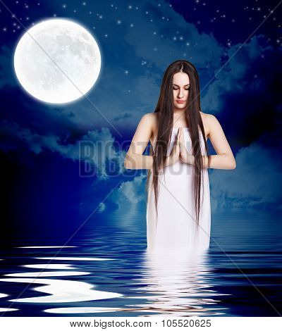 Woman in white shirt pray