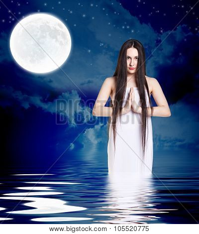Woman in white shirt pray