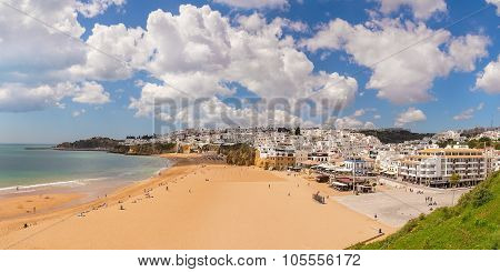 Summer View Of Albufeira Beach Fishermen. White Clouds. Portugal.