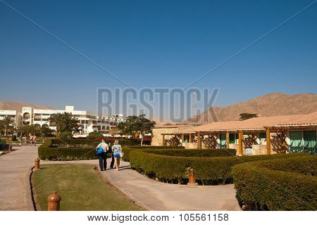 People Walk On the territory of a modern hotel