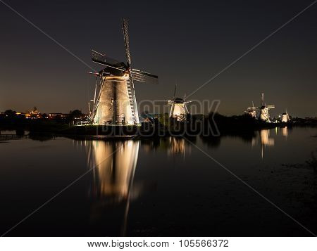 Windmills Lit At Night