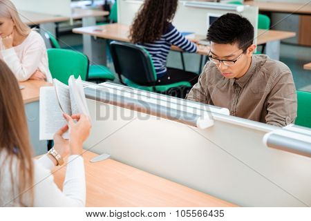 Portrait of a students studying in library