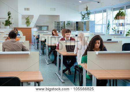 Portrait of a students studying in library