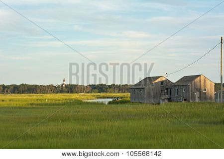 Virginia Wetlands With Lighthouse And Boathouse