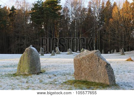 The Big Stones Standing In The Snow Field In Winter