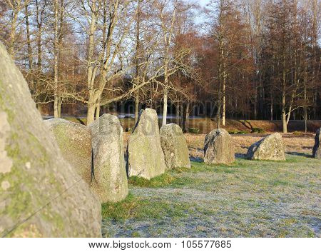 The Big Stones Standing In The Snow Field In Winter