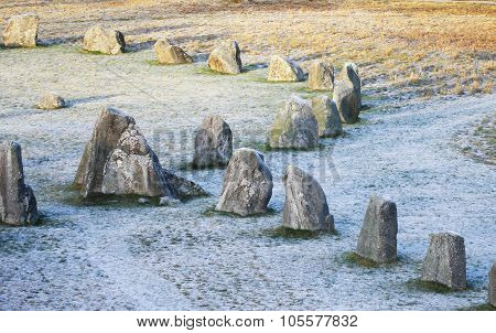 The Big Stones Standing In The Snow Field In Winter
