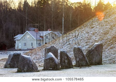 The Big Stones Standing In The Snow Field In Winter