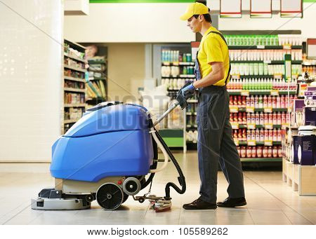 Floor care and cleaning services with washing machine in supermarket shop store