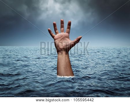 Drowning hand in stormy sea asking for help