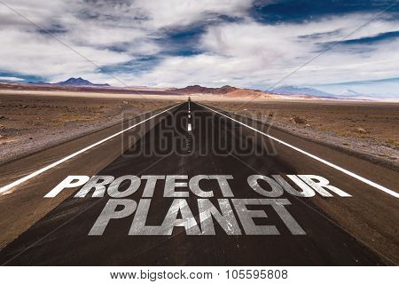 Protect Our Planet written on desert road