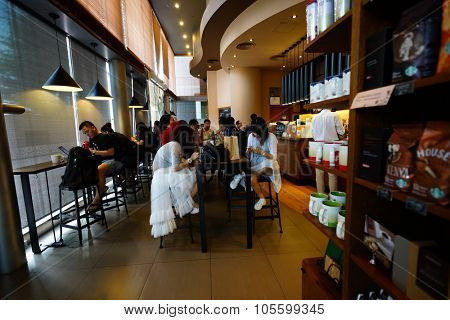 SHENZHEN, CHINA - OCTOBER 15, 2015: Starbucks Cafe interior. Starbucks Corporation is an American global coffee company and coffeehouse chain based in Seattle, Washington