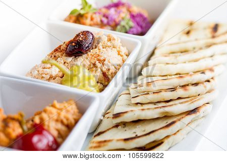 Harissa hummus feta ajvar and pita bread