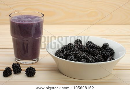 Smoothie From Blackberries  In A Glass And Blackberries  On Wooden Table