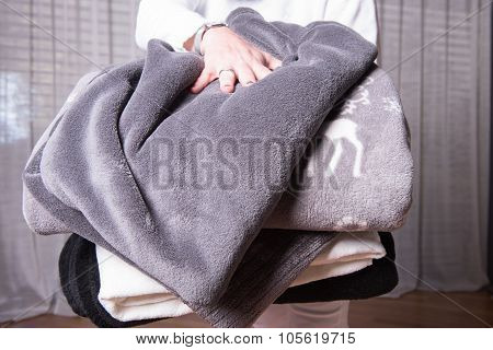 Female Helper Welcomes Refugees With Warm Blankets For Cold Nights