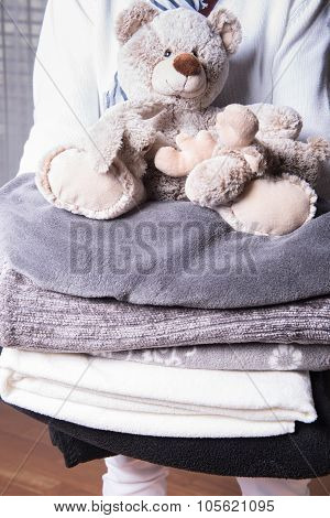 Female Helper Welcomes Refugees With Warm Blankets For Cold Nights