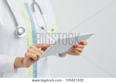 Female nurse using tablet