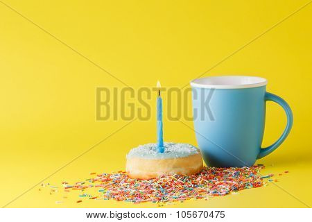 Donuts On Brigth Background With Blue Mug
