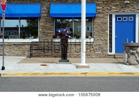 Sculpture of a Boy with a Flag