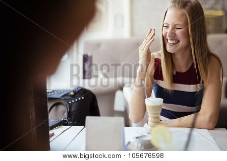 Beautiful Women Smiling In Restaurant