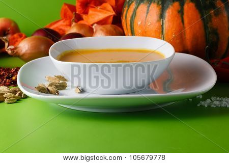 Pumpkin Soup With Onion And Pepper On Green Shadowless Backgroud