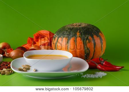 Pumpkin Soup With Onion And Pepper On Green Shadowless Backgroud