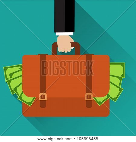 Businessman hand holding briefcase full of money