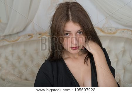 Portrait Of A Cute Girl On The Bed