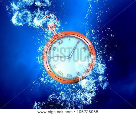 Pocket watch sink in clear blue water