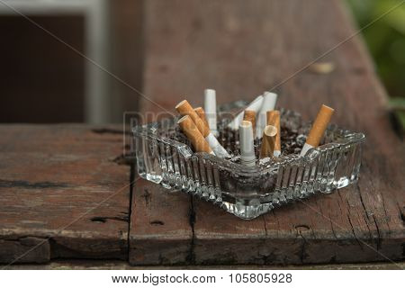 Ashtray On Wood Plank