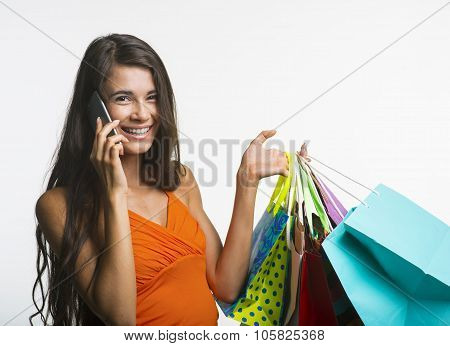 Merry woman on shopping during seasonal discounts.