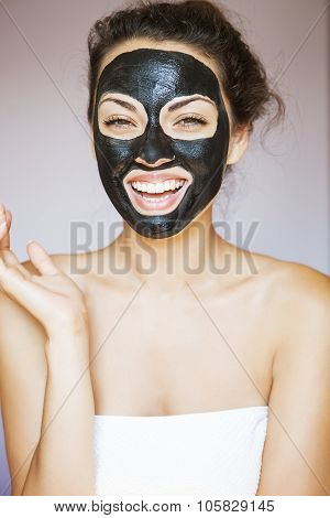 Young Woman With A Mask For The Face Of The Therapeutic Black Mud