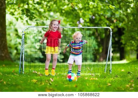 Kids Playing Football In School Yard
