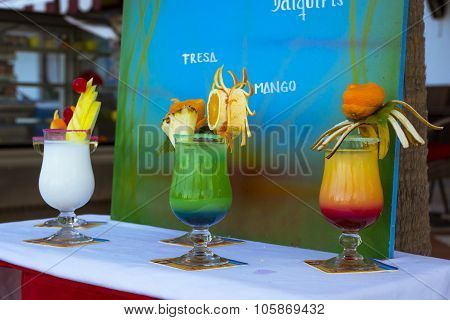 Delicious Layered Alcoholic Cocktails In Glasses, Decorated With Exotic Fruits, Tenerife