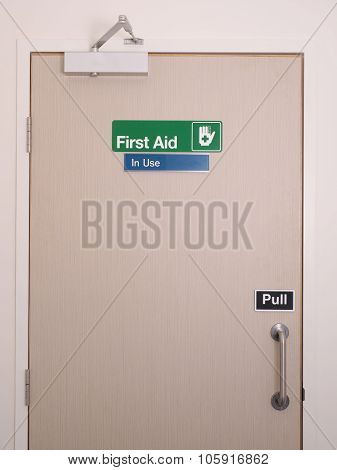 First aid door and sign with occupied indicator