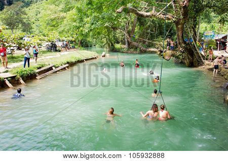 Tourists enjoy at Blue Lagoon, Vangvieng, Laos