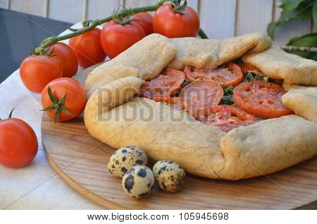 pie with tomatoes and greens