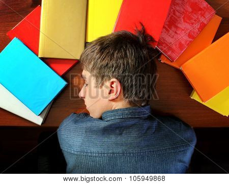 Young Man Sleep On The Books